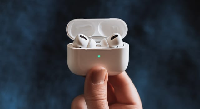 AirPods Pro in case with green light on