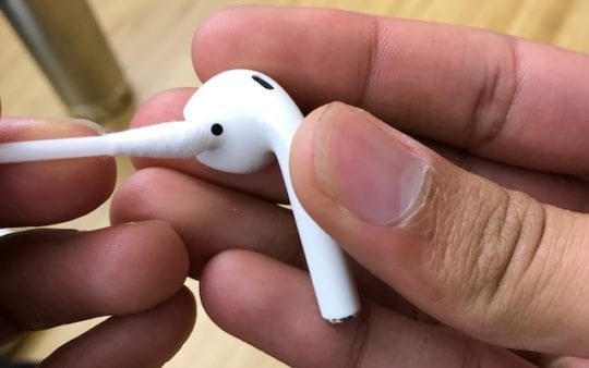 Clean AirPods with a cotton swab
